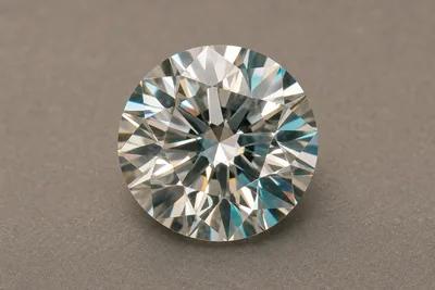 Macro photograph of a single brilliant-cut memorial diamond on a neutral surface